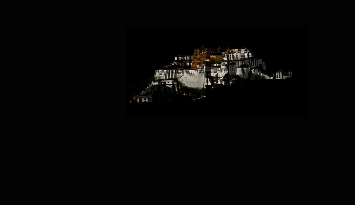 Perfect darkness Lhasa's Potala palace floats ghostlike above the darkened city. Photo: Billie Hughes