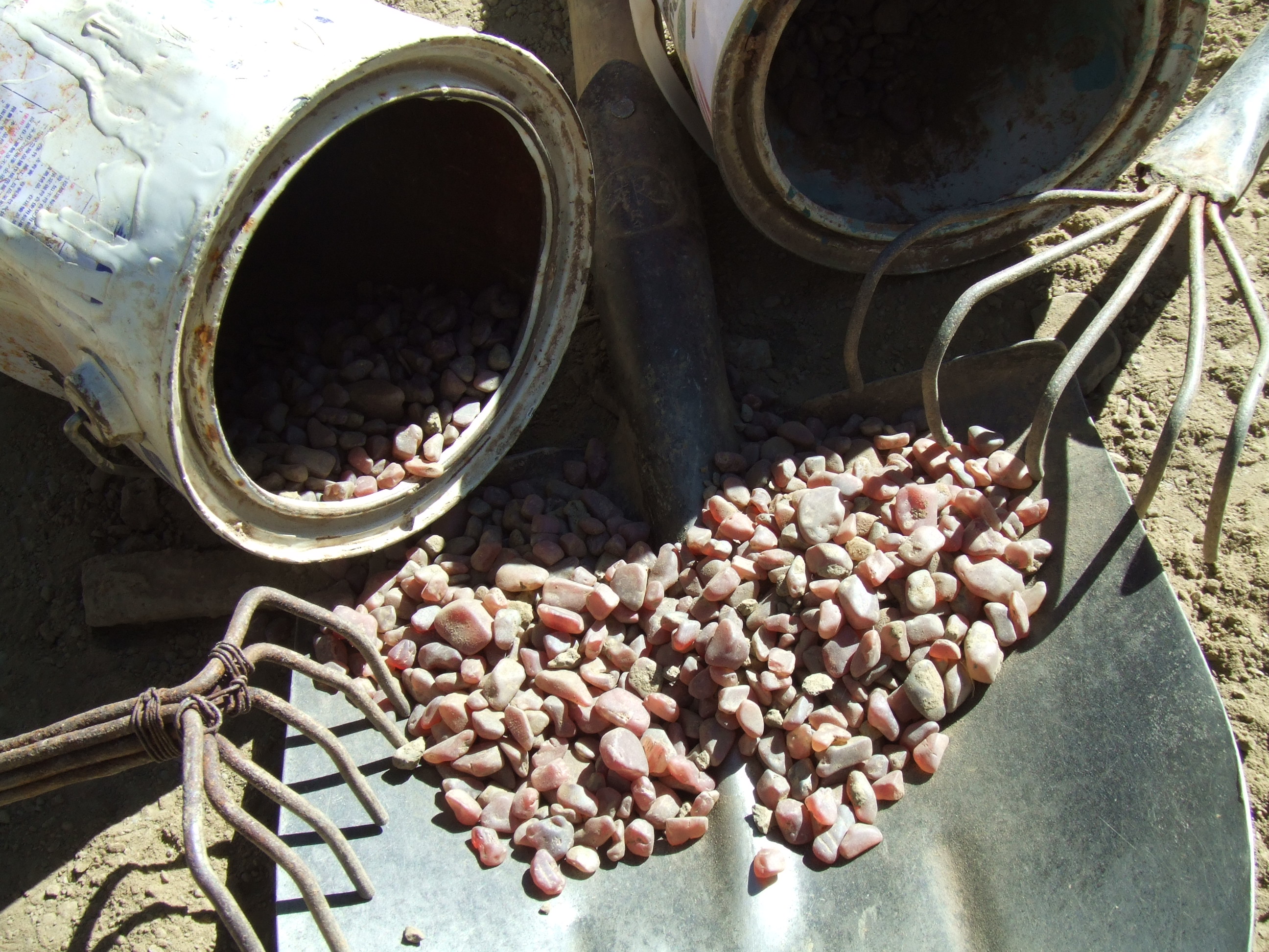 Figure 4. According to one internet pundit, this image from Ahmadjan Abduriyim's 2008 trip to Tibet shows tools that are too clean, the buckets without enough wear and the gemstones too perfectly matched to be representative of an actual mining operation. In order that readers can get a better look, Ahmadjan Abduriyim has provided an extremely high-resolution image. Make your own decision on these stones and tools. We report, you decide. Photo: Ahmadjan Abduriyim