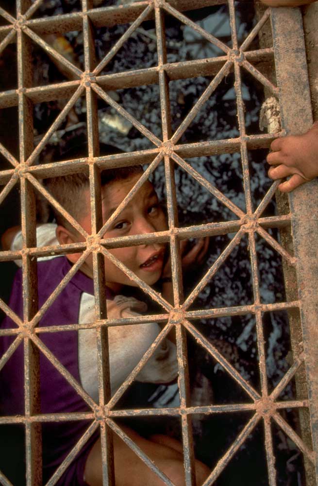 Boy looking for rubies in drain