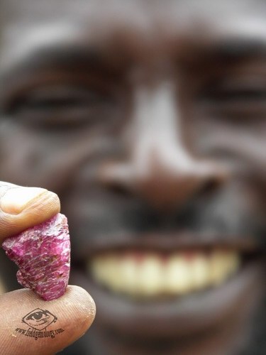 Mr. Esperitus, displaying his ruby find at Lukande, near Mahenge. He was responsible for first discovering the spinel mines at Ipanko.