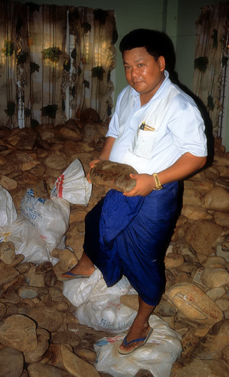 Figure 16. A room with a view U Tin Ngwe, who went from taxi driver to jade kingpin almost overnight, stands atop a small fortune of jade at his Hpakan home. Photo © Olivier Galibert.